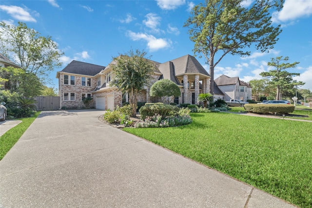 view of front facade featuring a front yard and a garage