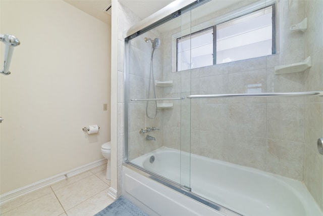 bathroom with toilet, combined bath / shower with glass door, and tile patterned floors