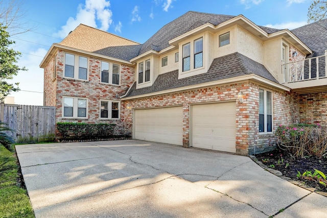 view of front of home featuring a balcony and a garage