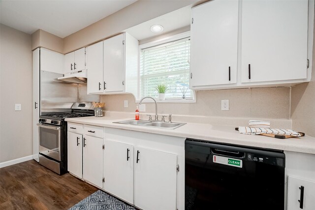 kitchen with a sink, stainless steel gas stove, dark wood finished floors, under cabinet range hood, and black dishwasher