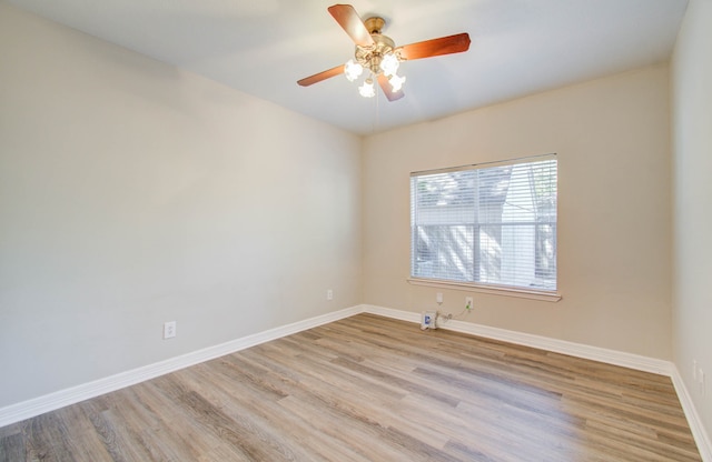 unfurnished room with light hardwood / wood-style floors and ceiling fan