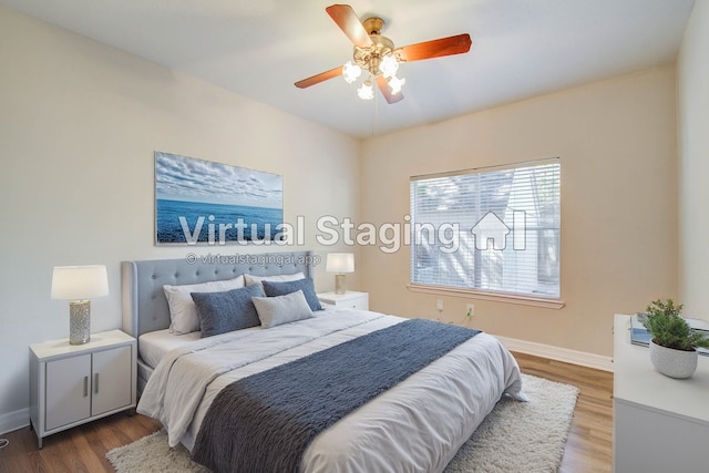 bedroom featuring wood-type flooring and ceiling fan