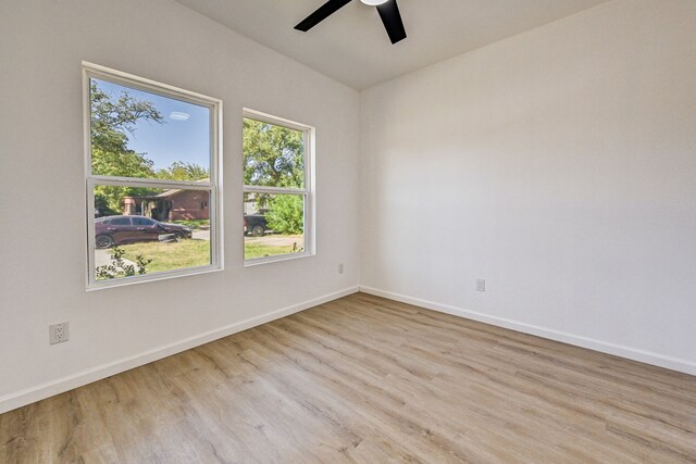 unfurnished room featuring light hardwood / wood-style flooring and ceiling fan