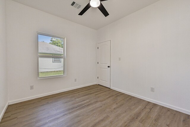 unfurnished room featuring hardwood / wood-style flooring and ceiling fan