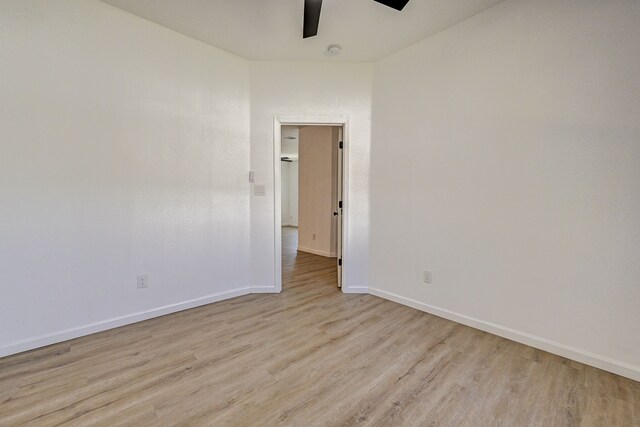 spare room with light hardwood / wood-style floors and ceiling fan