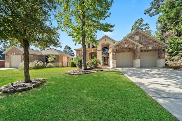 view of front of property with a front yard and a garage