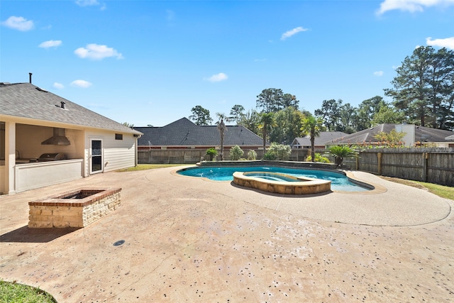 view of pool featuring area for grilling, an in ground hot tub, a patio, and a fire pit