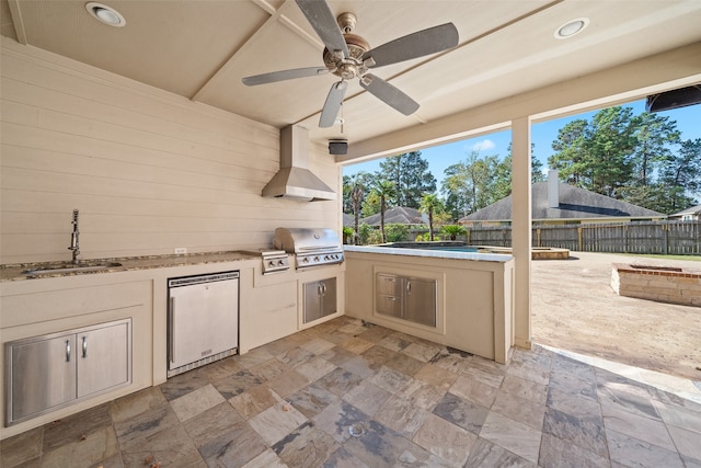 view of patio / terrace featuring grilling area, ceiling fan, exterior kitchen, and sink