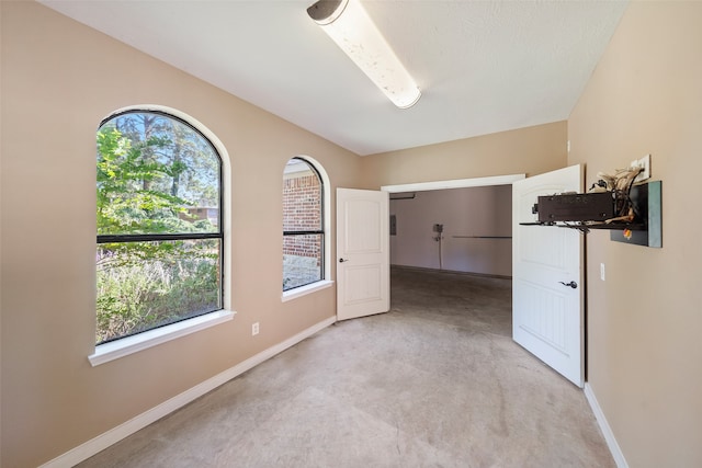 empty room with light colored carpet