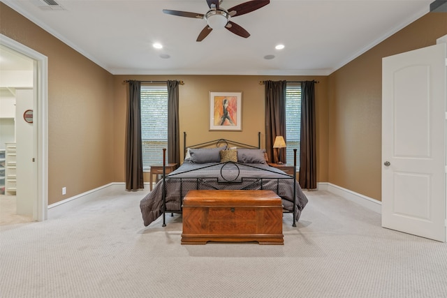 carpeted bedroom featuring multiple windows, crown molding, and ceiling fan