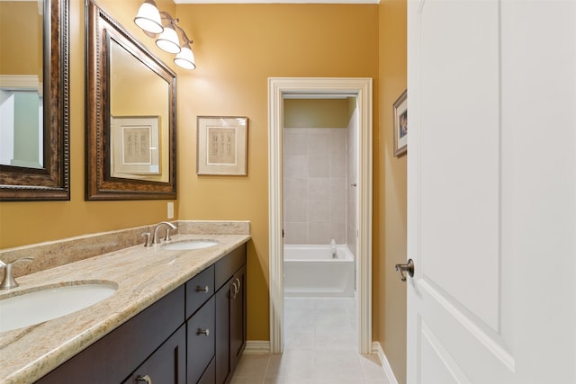 bathroom featuring vanity, a bathtub, and tile patterned floors