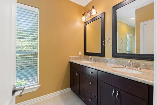 bathroom with vanity, ornamental molding, and tile patterned flooring