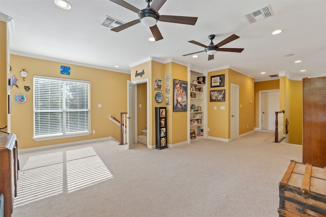 interior space featuring light carpet, ornamental molding, and ceiling fan