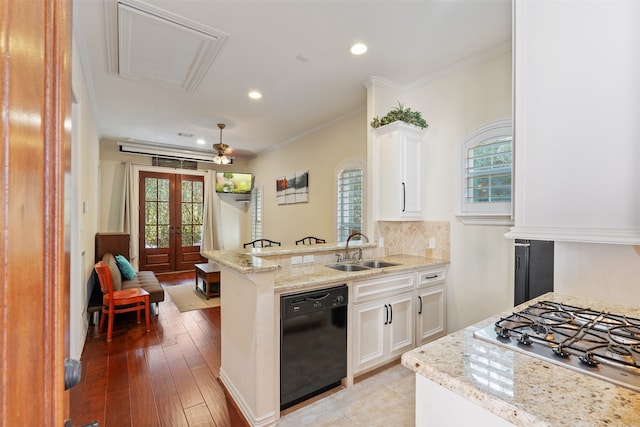 kitchen featuring stainless steel gas cooktop, black dishwasher, kitchen peninsula, sink, and white cabinets