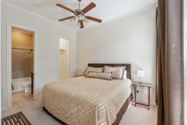 carpeted bedroom with ornamental molding, connected bathroom, and ceiling fan