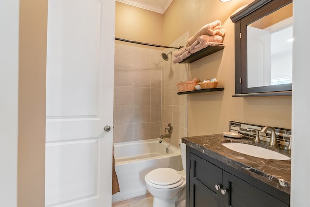 full bathroom featuring tiled shower / bath, toilet, ornamental molding, vanity, and tile patterned floors