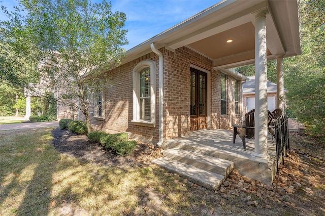 view of home's exterior featuring a wooden deck, a garage, and a lawn