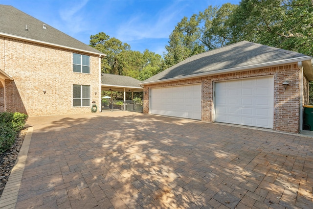 view of property exterior featuring an outbuilding and a garage