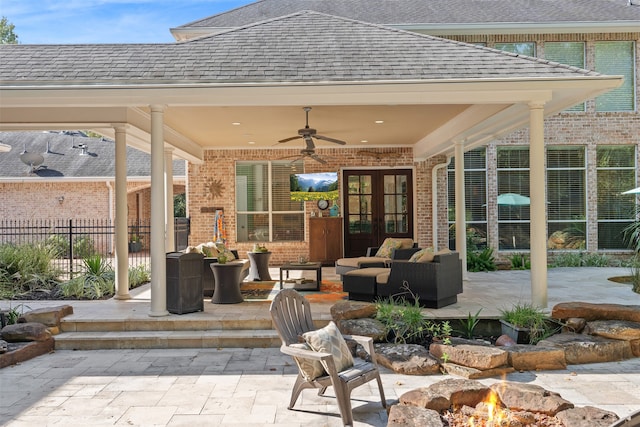 view of patio / terrace featuring french doors, outdoor lounge area, and ceiling fan