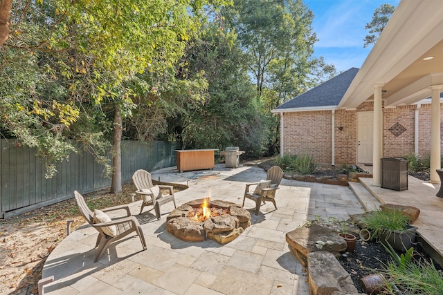 view of patio with a fire pit