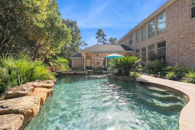 view of swimming pool featuring a patio area