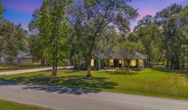 view of front of house with a yard