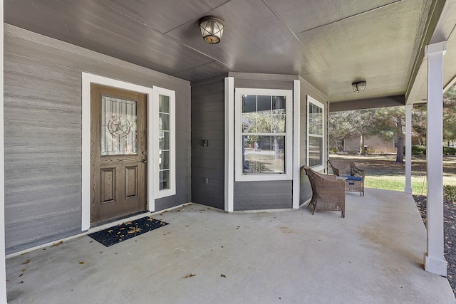 doorway to property featuring a porch