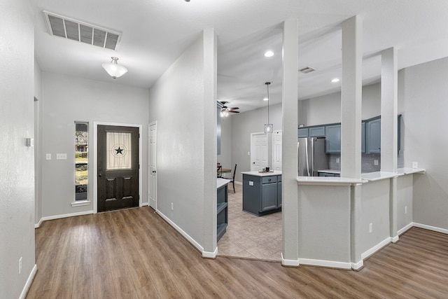 entrance foyer with light hardwood / wood-style floors and ceiling fan