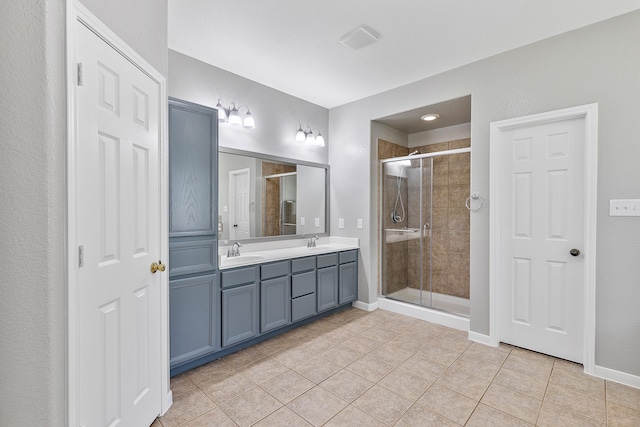 bathroom with vanity, tile patterned floors, and an enclosed shower