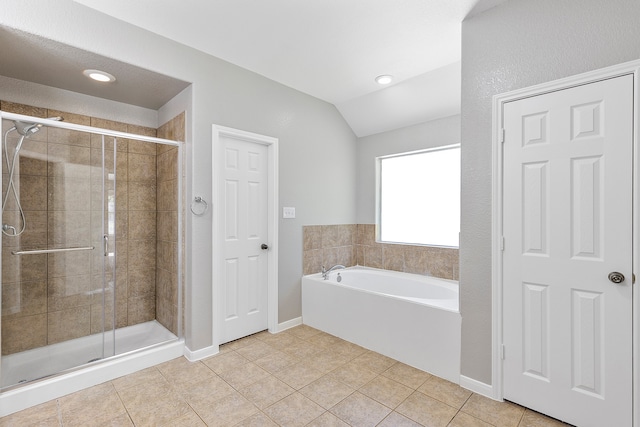 bathroom featuring tile patterned floors, independent shower and bath, and vaulted ceiling