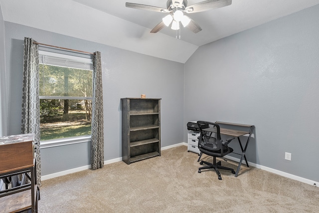 carpeted office space featuring ceiling fan and lofted ceiling