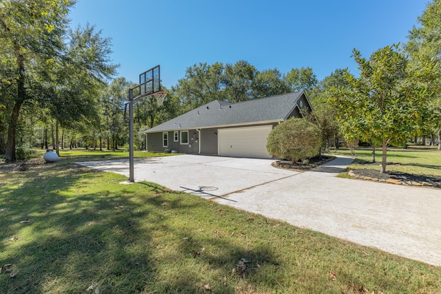 view of home's exterior with a lawn and a garage