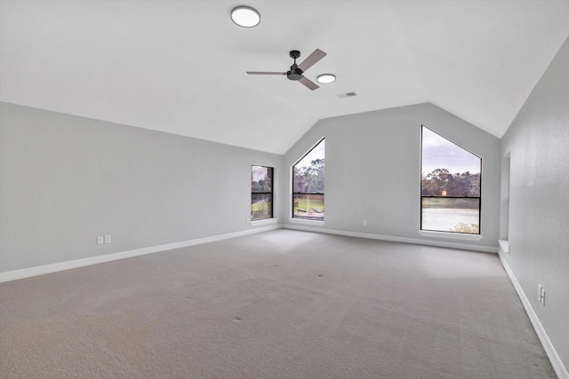 bonus room featuring ceiling fan, light colored carpet, and vaulted ceiling