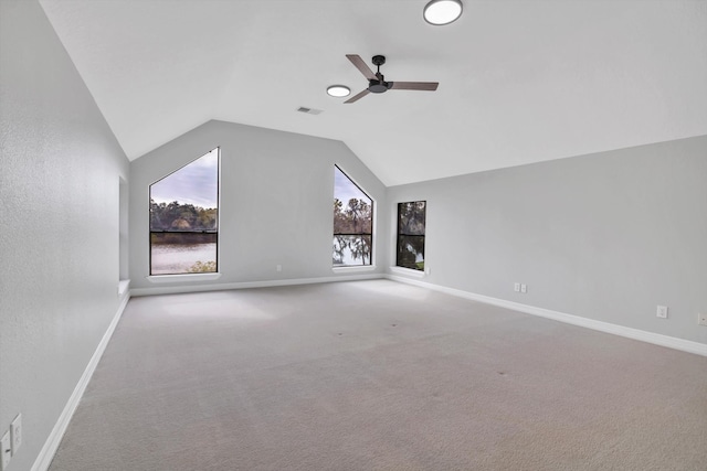 additional living space featuring lofted ceiling, carpet flooring, and ceiling fan