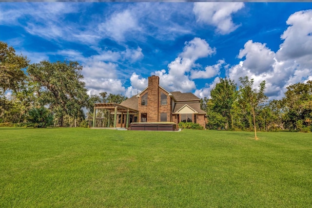 816 Lake Rd, Lake Jackson, TX 77566 - back of house featuring a hot tub, a lawn, a chimney, a pergola, and a shingled roof