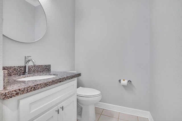 bathroom featuring vanity, toilet, and tile patterned floors