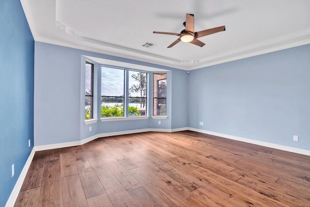 816 Lake Rd, Lake Jackson, TX 77566 - unfurnished room featuring a ceiling fan, wood-type flooring, baseboards, and ornamental molding