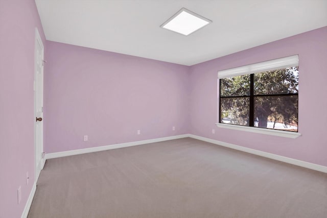 816 Lake Rd, Lake Jackson, TX 77566 - carpeted spare room featuring baseboards