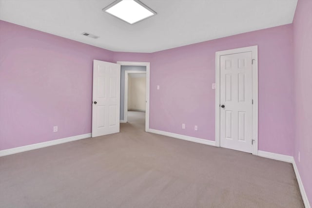 816 Lake Rd, Lake Jackson, TX 77566 - unfurnished bedroom featuring carpet and baseboards
