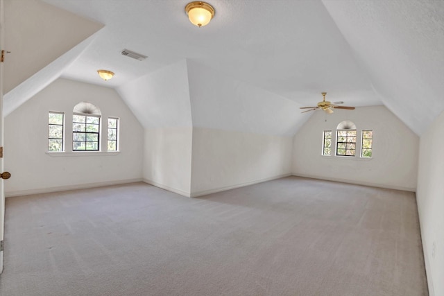 816 Lake Rd, Lake Jackson, TX 77566 - bonus room with carpet floors, lofted ceiling, a ceiling fan, and baseboards