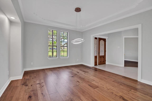816 Lake Rd, Lake Jackson, TX 77566 - empty room with hardwood / wood-style flooring, crown molding, baseboards, recessed lighting, and a chandelier