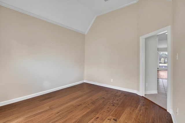 unfurnished room with ornamental molding, hardwood / wood-style floors, and vaulted ceiling