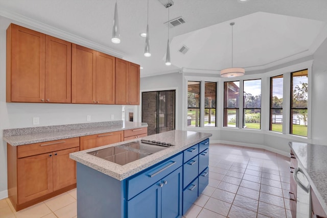 816 Lake Rd, Lake Jackson, TX 77566 - kitchen featuring light tile patterned flooring, a kitchen island, decorative light fixtures, baseboards, and a sink
