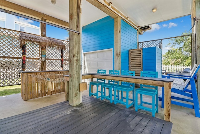 wooden terrace with a garage