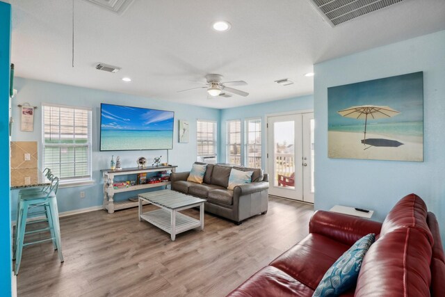 11218 Reagor Way, Galveston, TX 77554 - living area featuring wood finished floors, attic access, baseboards, ceiling fan, and recessed lighting