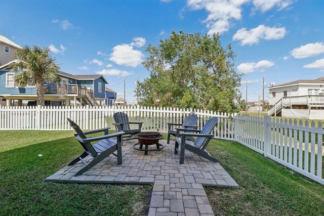 11218 Reagor Way, Galveston, TX 77554 - view of patio / terrace with an outdoor fire pit and a residential view