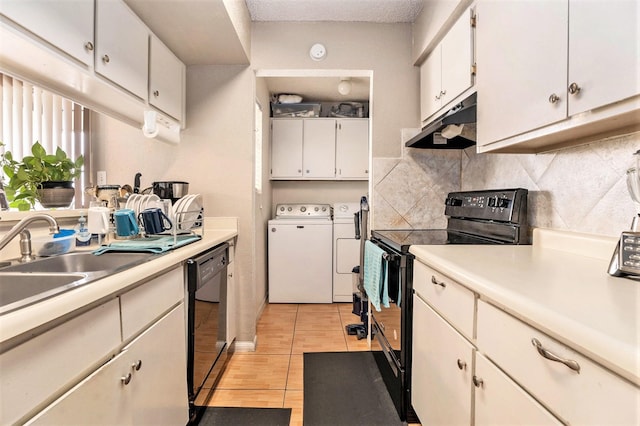 kitchen with decorative backsplash, white cabinets, separate washer and dryer, light wood-type flooring, and black appliances