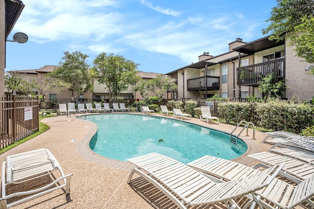 view of swimming pool featuring a patio area