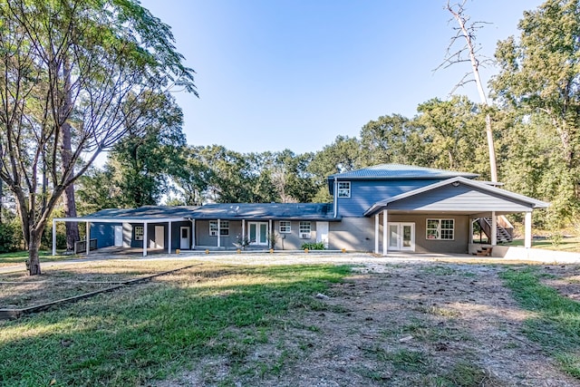 back of house featuring a yard