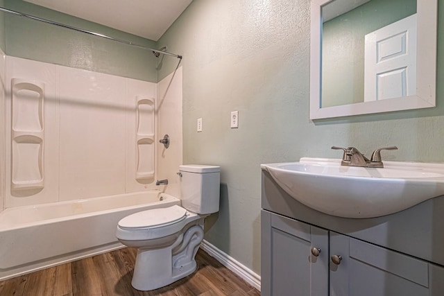 full bathroom featuring vanity, hardwood / wood-style floors, toilet, and shower / bath combination